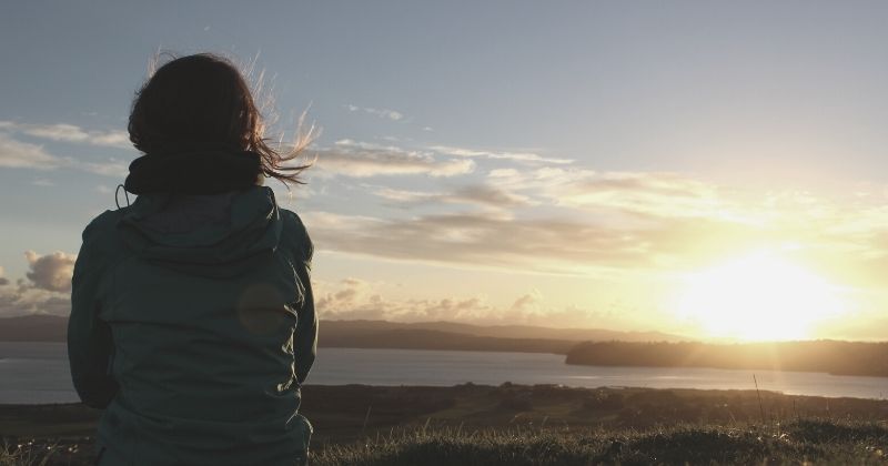 woman looking to the sunset after making a career change
