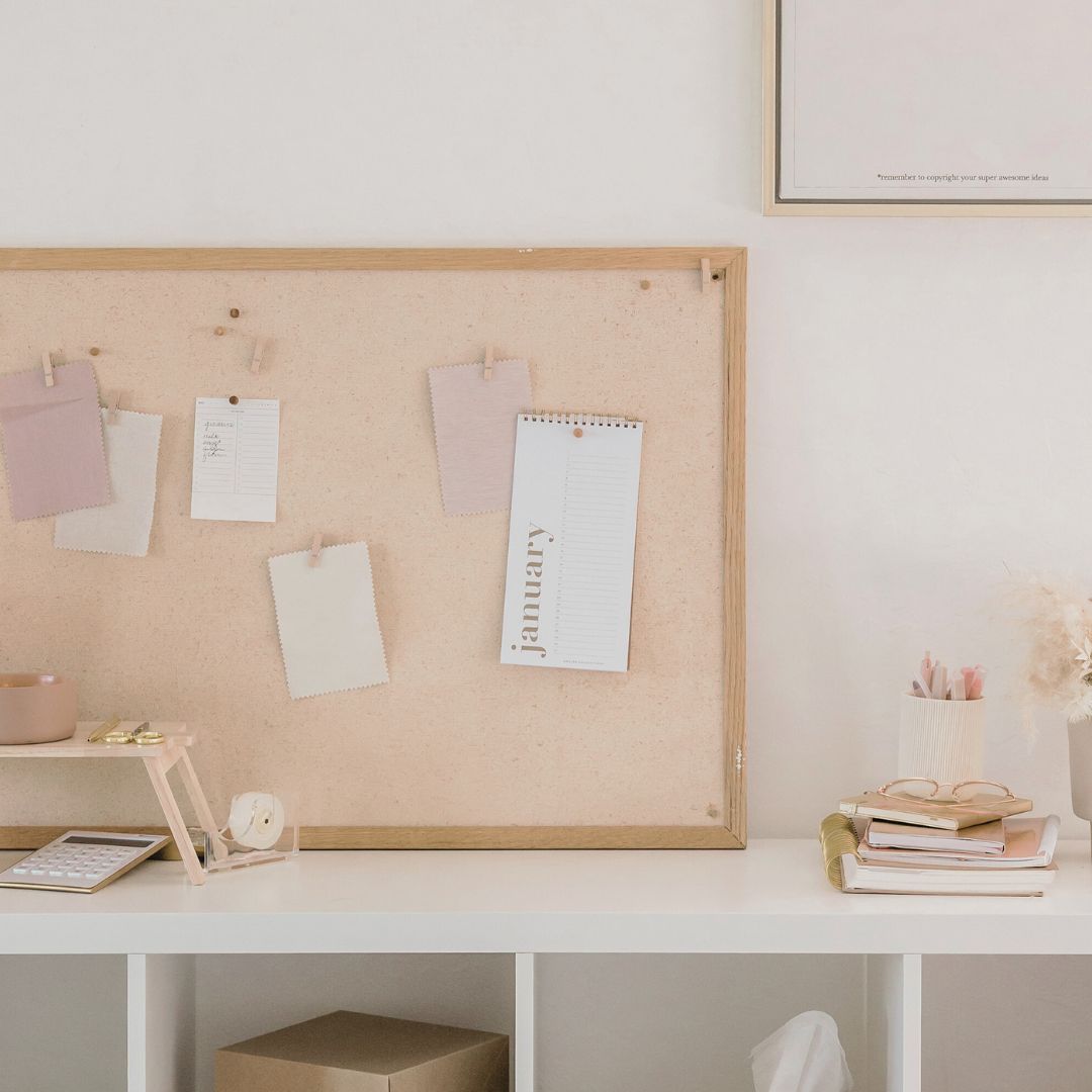 New Year, New Intentions, desk with corkboard and inspirational notes | Flourish Careers